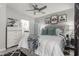 Bedroom featuring a tufted headboard bed, mirrored nightstand, and stylish art at 7575 E Indian Bend Rd # 1142, Scottsdale, AZ 85250