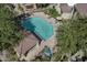 Aerial view of a refreshing pool and spa with lounge chairs, gazebo, and lush landscaping at 7575 E Indian Bend Rd # 1142, Scottsdale, AZ 85250
