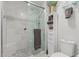 Elegant tiled shower with a glass door and storage shelves at 7575 E Indian Bend Rd # 1142, Scottsdale, AZ 85250