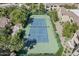 Aerial view of a pristine tennis court within a beautifully landscaped community at 7575 E Indian Bend Rd # 1142, Scottsdale, AZ 85250