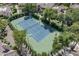 Aerial view of a well-maintained tennis court surrounded by lush greenery in the community at 7575 E Indian Bend Rd # 1142, Scottsdale, AZ 85250