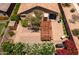 Private backyard featuring a large brick patio, pergola, shed, and mature landscaping at 7648 S Thimble Peak --, Gold Canyon, AZ 85118