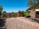 Serene backyard showcasing a storage shed and brick pathway amidst desert landscaping at 7648 S Thimble Peak --, Gold Canyon, AZ 85118