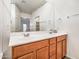 Spacious bathroom featuring a double vanity, neutral colors, and a large mirror at 7648 S Thimble Peak --, Gold Canyon, AZ 85118