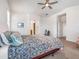 Bright bedroom featuring neutral colors, plush bedding, and a ceiling fan for added comfort at 7648 S Thimble Peak --, Gold Canyon, AZ 85118