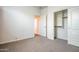 Bright bedroom with plush carpet and an adjacent closet for plenty of storage at 7648 S Thimble Peak --, Gold Canyon, AZ 85118