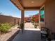 Enjoy the outdoor patio with lovely landscaping, stylish pergola, and charming lounge seating at 7648 S Thimble Peak --, Gold Canyon, AZ 85118