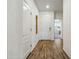Hallway featuring wood-look tile and white walls, offering a modern feel at 7648 S Thimble Peak --, Gold Canyon, AZ 85118