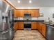 Well-equipped kitchen featuring stainless steel appliances and wooden cabinetry at 7648 S Thimble Peak --, Gold Canyon, AZ 85118
