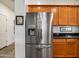Open kitchen design with stainless steel refrigerator and wooden cabinets at 7648 S Thimble Peak --, Gold Canyon, AZ 85118