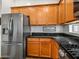 Well-lit kitchen featuring wood cabinetry, stainless steel appliances, and granite countertops at 7648 S Thimble Peak --, Gold Canyon, AZ 85118