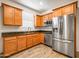 Modern kitchen featuring stainless steel appliances, wood cabinetry, and sleek granite countertops at 7648 S Thimble Peak --, Gold Canyon, AZ 85118