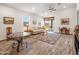 Spacious living room with natural light, wood flooring, and sliding door access to the backyard at 7648 S Thimble Peak --, Gold Canyon, AZ 85118