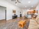 Open-concept living room boasts wood floors, neutral colors, and seamlessly connects to the kitchen for easy entertaining at 7648 S Thimble Peak --, Gold Canyon, AZ 85118