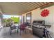 View of a covered outdoor patio with furniture and a grill, ideal for relaxation at 8103 E Southern Ave # 75, Mesa, AZ 85209