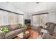 Comfortable living room with plush sofas, a TV, and bright natural light at 8103 E Southern Ave # 75, Mesa, AZ 85209