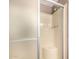 This stand-up shower features a built-in seat and frosted glass door for privacy and convenience at 8103 E Southern Ave # 75, Mesa, AZ 85209