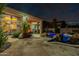 A private backyard with a swimming pool, patio and outdoor lounging areas with beautiful landscaping at 9678 E Voltaire Dr, Scottsdale, AZ 85260