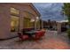 Spacious backyard patio with comfortable seating, fire feature, and access to pool, perfect for entertaining and relaxing at 9678 E Voltaire Dr, Scottsdale, AZ 85260
