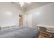 Minimalist bedroom featuring a bed, desk, and natural light with views of the backyard at 9678 E Voltaire Dr, Scottsdale, AZ 85260