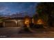 Charming front exterior of a single-Gathering home with a well-manicured lawn and lush landscaping at 9678 E Voltaire Dr, Scottsdale, AZ 85260