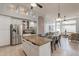 Spacious kitchen with granite counters, stainless steel appliances, and an open layout to the living area at 9678 E Voltaire Dr, Scottsdale, AZ 85260