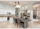 Bright kitchen with white cabinets, granite countertops, stainless steel appliances, and a center island at 9678 E Voltaire Dr, Scottsdale, AZ 85260