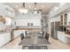Spacious kitchen with stainless steel appliances, an island, and a dining table with seating at 9678 E Voltaire Dr, Scottsdale, AZ 85260