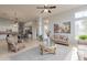 Open-concept living area with comfortable seating, a view into the kitchen, and natural lighting at 9678 E Voltaire Dr, Scottsdale, AZ 85260