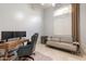 Comfortable home office with a desk, chair, futon, and a large window for natural light at 9678 E Voltaire Dr, Scottsdale, AZ 85260