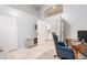 Open office space featuring a modern desk, comfortable chair, and a view into the hallway at 9678 E Voltaire Dr, Scottsdale, AZ 85260