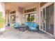 Covered patio with stylish furniture, including a sofa, chairs, and a fire pit, perfect for enjoying the outdoors at 9678 E Voltaire Dr, Scottsdale, AZ 85260