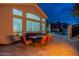 Outdoor patio dining area provides ample seating, beautiful lighting and comfortable seating at 9678 E Voltaire Dr, Scottsdale, AZ 85260