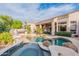 Aerial view of backyard pool and spa, lush landscaping, and covered patios, creating a private outdoor oasis at 9678 E Voltaire Dr, Scottsdale, AZ 85260