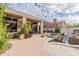 Backyard pool, outdoor patio and covered seating area with a beautiful desert landscape design at 9678 E Voltaire Dr, Scottsdale, AZ 85260