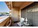 Cozy balcony setup with outdoor furniture, views of the community, and natural sunlight at 10410 N Cave Creek Rd # 2030, Phoenix, AZ 85020