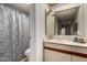Bathroom featuring decorative shower curtain, vanity, medicine cabinet, and modern sink at 10410 N Cave Creek Rd # 2030, Phoenix, AZ 85020