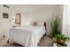 Comfortable bedroom with a white coverlet, leading to a view of the en suite bathroom at 10410 N Cave Creek Rd # 2030, Phoenix, AZ 85020