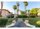 Entrance featuring well-maintained landscaping and palm trees in a beautiful community at 10410 N Cave Creek Rd # 2030, Phoenix, AZ 85020