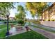 Park-like setting with mature trees and a sitting area for relaxing at 10410 N Cave Creek Rd # 2030, Phoenix, AZ 85020