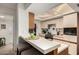 Bright and open kitchen with breakfast bar, modern appliances, and access to adjacent rooms at 10410 N Cave Creek Rd # 2030, Phoenix, AZ 85020