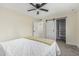 Simple bedroom with a standard closet and a white-painted ceiling fan at 11215 N 38Th N Ave, Phoenix, AZ 85029