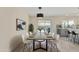 Elegant dining room featuring a long table with seating and an adjacent breakfast bar at 11215 N 38Th N Ave, Phoenix, AZ 85029