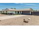 Charming home with a dark gray garage door, rock landscaping, and curb appeal at 11215 N 38Th N Ave, Phoenix, AZ 85029