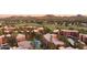 Stunning aerial view showcasing the community pool, golf course, and mountain views at 12222 N Paradise Village S Pkwy # 442, Phoenix, AZ 85032