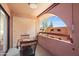 Private balcony featuring a dining table set and an open area with an exterior view at 12222 N Paradise Village S Pkwy # 442, Phoenix, AZ 85032