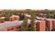 Community overview with beautiful buildings featuring balconies, and mature landscaping at 12222 N Paradise Village S Pkwy # 442, Phoenix, AZ 85032