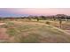 Scenic view of a well-maintained golf course with lush green fairways, trees and mountain backdrop at 12222 N Paradise Village S Pkwy # 442, Phoenix, AZ 85032