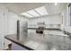Bright kitchen featuring white cabinets, stainless steel appliances, and modern countertops at 12222 N Paradise Village S Pkwy # 442, Phoenix, AZ 85032