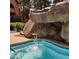 Inviting community pool featuring a stunning rock waterfall for a serene, resort-like feel at 12222 N Paradise Village S Pkwy # 442, Phoenix, AZ 85032